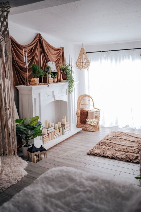 A room with a fireplace and plants in it