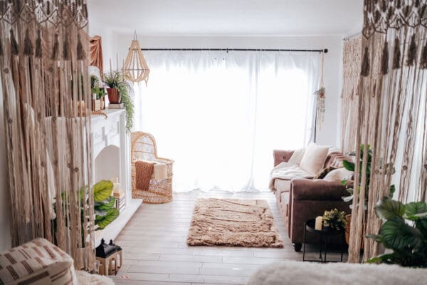 A living room with white walls and wooden floors.