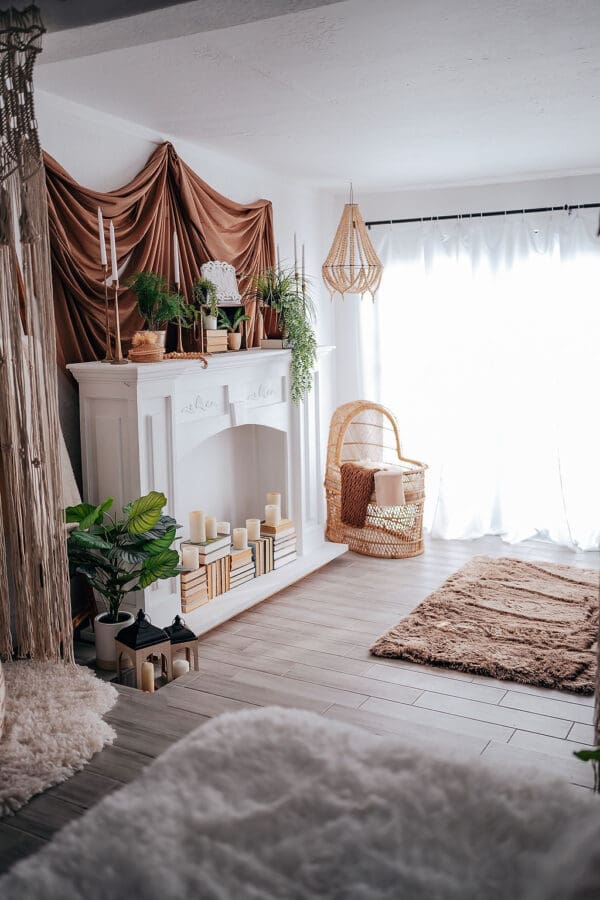 A room with a fireplace and plants in it