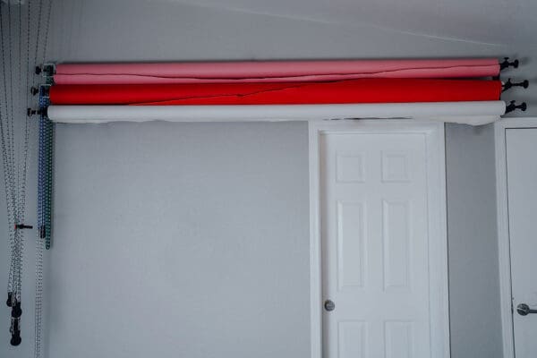 A white door with red trim on the top of it.