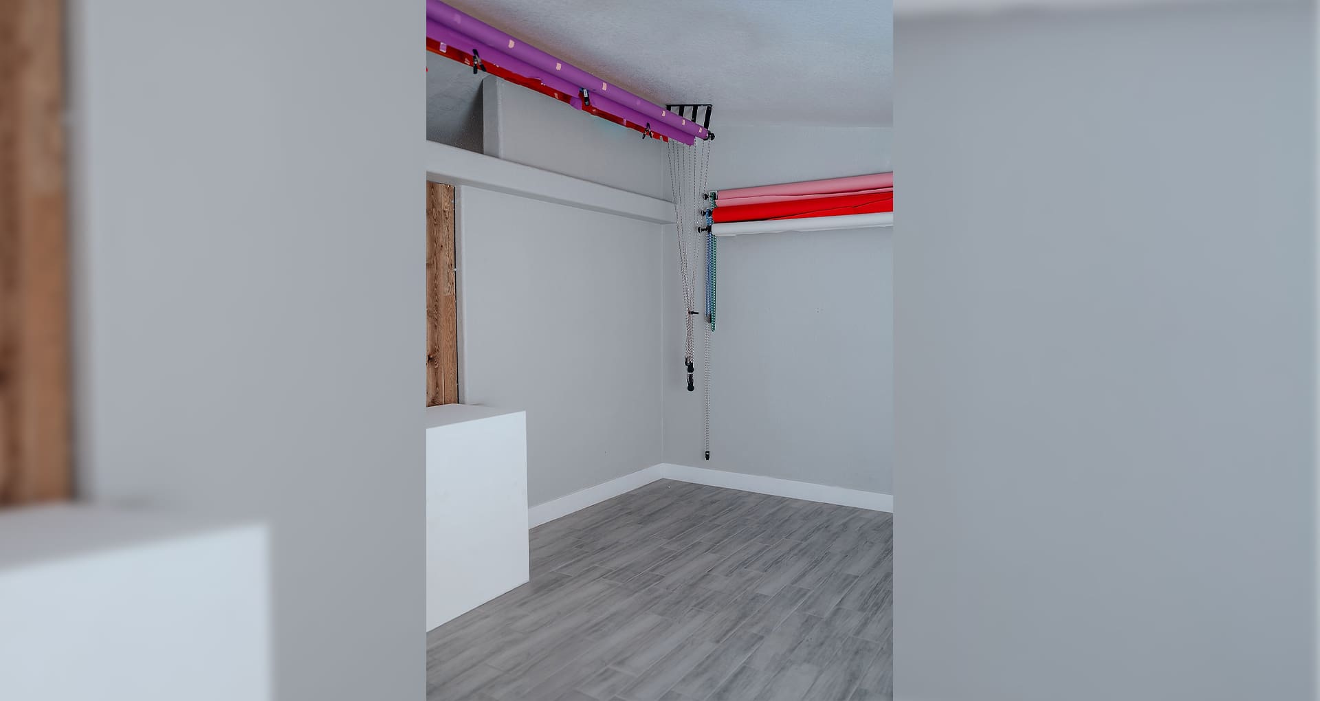 A room with a red ceiling and white walls.